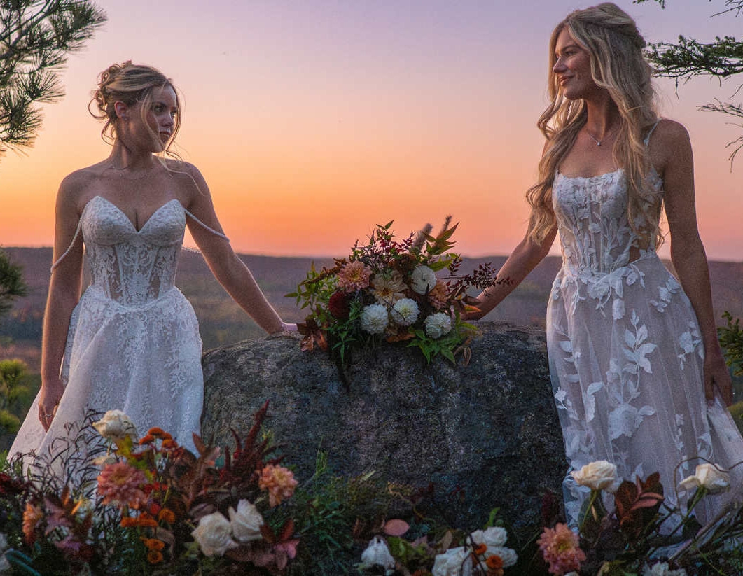 Photo of the models wearing a white gowns - mobile image